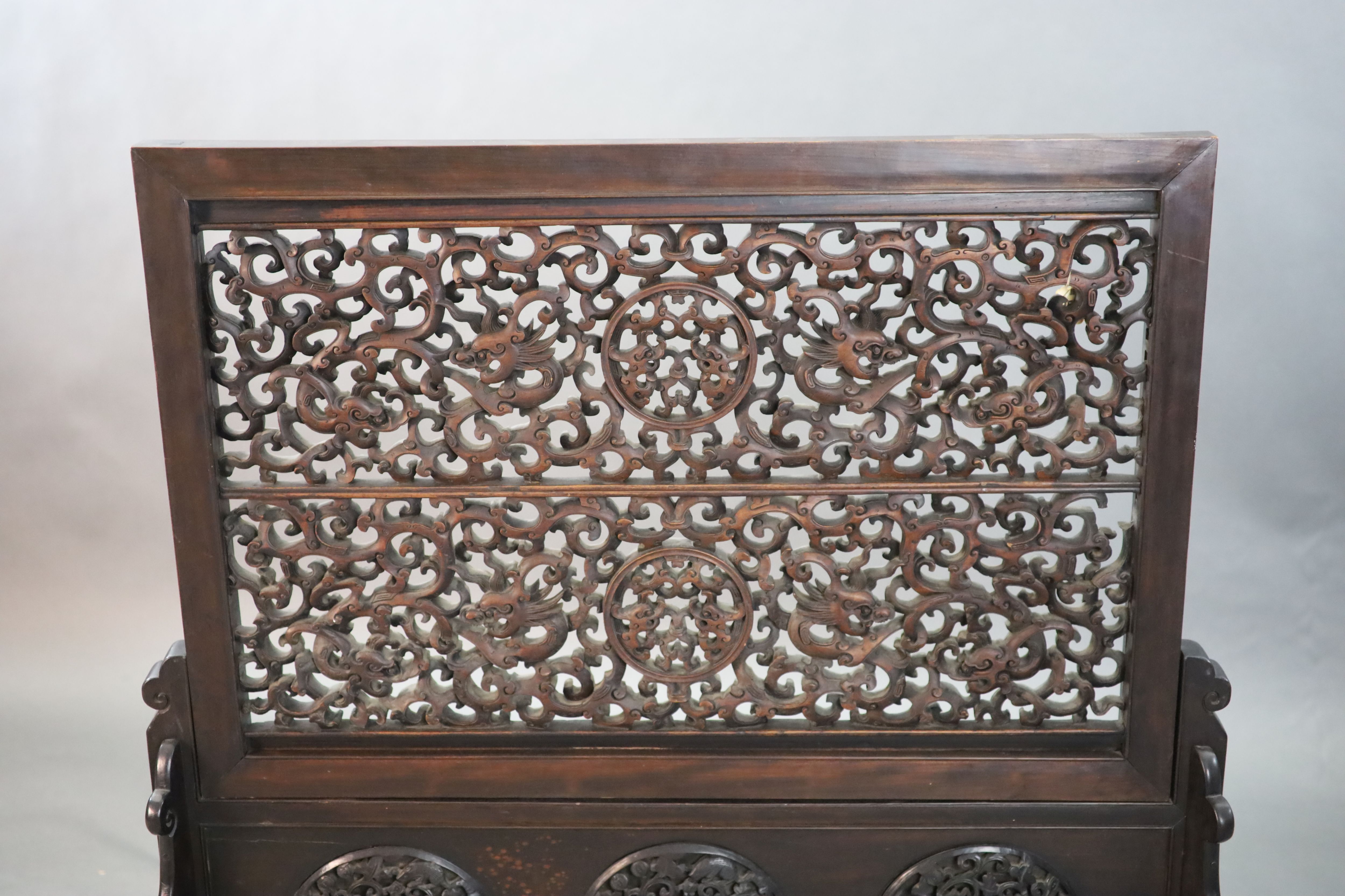 A large Chinese hardwood table screen, c.1910, 93.5cm high, 93.5cm wide, Provenance - A. T. Arber-Cooke